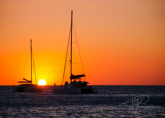 Santorini sunset over sailboats