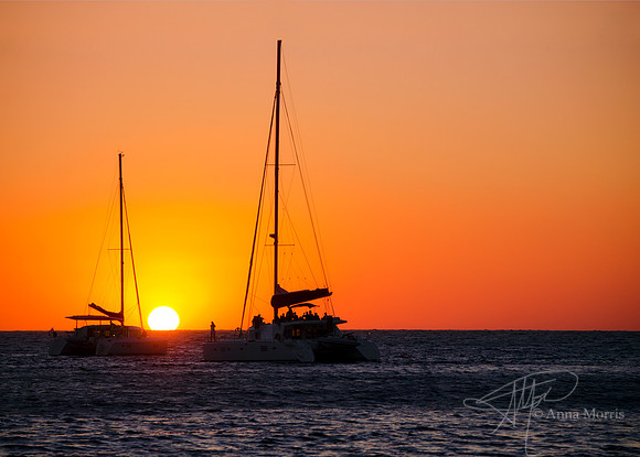 Santorini sunset over sailboats